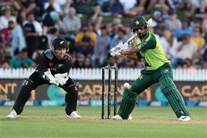 HAMILTON, NEW ZEALAND - DECEMBER 20: Mohammad Hafeez of Pakistan takes a shot with Tim Seifert of New Zealand (L) during game two of the International T20 series between New Zealand and Pakistan at Seddon Park on December 20, 2020 in Hamilton, New Zealand. (Photo by Fiona Goodall/Getty Images)