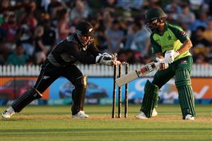 HAMILTON, NEW ZEALAND - DECEMBER 20: Mohammad Hafeez of Pakistan swings with Tim Seifert of New Zealand (L) taking the ball during the game two of the International T20 series between New Zealand and Pakistan at Seddon Park on December 20, 2020 in Hamilton, New Zealand. (Photo by Fiona Goodall/Getty Images)