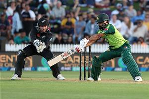 HAMILTON, NEW ZEALAND - DECEMBER 20: Mohammad Hafeez of Pakistan takes a shot with Tim Seifert of New Zealand (L) during game two of the International T20 series between New Zealand and Pakistan at Seddon Park on December 20, 2020 in Hamilton, New Zealand. (Photo by Fiona Goodall/Getty Images)