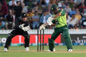 HAMILTON, NEW ZEALAND - DECEMBER 20: Mohammad Hafeez of Pakistan takes a shot with Tim Seifert of New Zealand (L) during game two of the International T20 series between New Zealand and Pakistan at Seddon Park on December 20, 2020 in Hamilton, New Zealand. (Photo by Fiona Goodall/Getty Images)