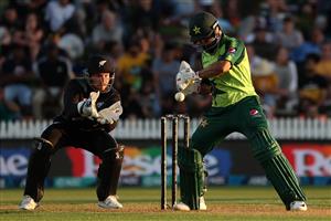 HAMILTON, NEW ZEALAND - DECEMBER 20: Mohammad Hafeez of Pakistan swings with Tim Seifert of New Zealand (L) taking the ball during the game two of the International T20 series between New Zealand and Pakistan at Seddon Park on December 20, 2020 in Hamilton, New Zealand. (Photo by Fiona Goodall/Getty Images)