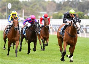 MELBOURNE, AUSTRALIA - DECEMBER 19: Jockey Campbell Rawiller riding Defiant Dancer to win Race 7, the Furphy Festive Season Sprint, during Melbourne Racing at Flemington Racecourse on December 19, 2020 in Melbourne, Australia. (Photo by Vince Caligiuri/Getty Images)