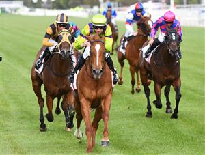 MELBOURNE, AUSTRALIA - DECEMBER 19: Damian Lane riding Sword of Mercy to win Race 9, the G.h. Mumm Christmas Plate, during Melbourne Racing at Flemington Racecourse on December 19, 2020 in Melbourne, Australia. (Photo by Vince Caligiuri/Getty Images)