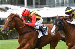 MELBOURNE, AUSTRALIA - DECEMBER 19: Damien Oliver riding Vassilator wins Race 8, the Kennedy Handicap, during Melbourne Racing at Flemington Racecourse on December 19, 2020 in Melbourne, Australia. (Photo by Vince Caligiuri/Getty Images)