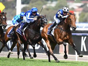 MELBOURNE, AUSTRALIA - DECEMBER 19: Jamie Kah riding Lunakorn to win race 6, the Merry Christmas Vrc Members Plate, during Melbourne Racing at Flemington Racecourse on December 19, 2020 in Melbourne, Australia. (Photo by Vince Caligiuri/Getty Images)