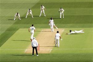 ADELAIDE, AUSTRALIA - DECEMBER 17: Matthew Wade of Australia attempts to catch a shot by Virat Kohli of India off the bowling of Pat Cummins of Australia during day one of the First Test match between Australia and India at Adelaide Oval on December 17, 2020 in Adelaide, Australia. (Photo by Cameron Spencer/Getty Images)
