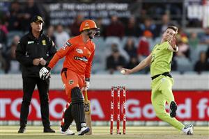 CANBERRA, AUSTRALIA - DECEMBER 22: Adam Milne of the Thunder slips as he bowls during the Big Bash League match between the Sydney Thunder and the Perth Scorchers at Manuka Oval, on December 22, 2020, in Canberra, Australia. (Photo by Darrian Traynor/Getty Images)