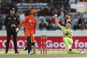 CANBERRA, AUSTRALIA - DECEMBER 22: Adam Milne of the Thunder slips as he bowls during the Big Bash League match between the Sydney Thunder and the Perth Scorchers at Manuka Oval, on December 22, 2020, in Canberra, Australia. (Photo by Darrian Traynor/Getty Images)