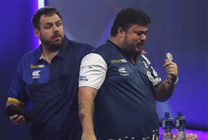 LONDON, ENGLAND - DECEMBER 22: Adrian Lewis of England (L) and Danny Baggish of The United States congratulate each other after there second round match during day eight of the PDC William Hill World Darts Championship at Alexandra Palace on December 22, 2020 in London, England. (Photo by Luke Walker/Getty Images)