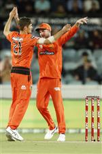 CANBERRA, AUSTRALIA - DECEMBER 22: Aaron Hardie of the Scorchers celebrates the wicket of Usman Khawaja of the Thunder during the Big Bash League match between the Sydney Thunder and the Perth Scorchers at Manuka Oval, on December 22, 2020, in Canberra, Australia. (Photo by Darrian Traynor/Getty Images)