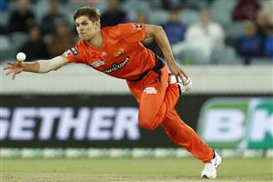 CANBERRA, AUSTRALIA - DECEMBER 22: Aaron Hardie of the Scorchers dives for the ball during the Big Bash League match between the Sydney Thunder and the Perth Scorchers at Manuka Oval, on December 22, 2020, in Canberra, Australia. (Photo by Darrian Traynor/Getty Images)