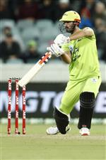 CANBERRA, AUSTRALIA - DECEMBER 22: Ben Cutting of the Thunder hits the winning runs during the Big Bash League match between the Sydney Thunder and the Perth Scorchers at Manuka Oval, on December 22, 2020, in Canberra, Australia. (Photo by Darrian Traynor/Getty Images)