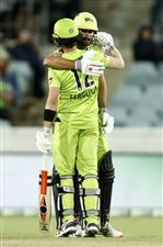 CANBERRA, AUSTRALIA - DECEMBER 22: Callum Ferguson and Ben Cutting of the Thunder embrace after the Thunder won the Big Bash League match between the Sydney Thunder and the Perth Scorchers at Manuka Oval, on December 22, 2020, in Canberra, Australia. (Photo by Darrian Traynor/Getty Images)