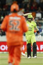 CANBERRA, AUSTRALIA - DECEMBER 22: Callum Ferguson of the Thunder raises his bat after scoring 50 runs during the Big Bash League match between the Sydney Thunder and the Perth Scorchers at Manuka Oval, on December 22, 2020, in Canberra, Australia. (Photo by Darrian Traynor/Getty Images)