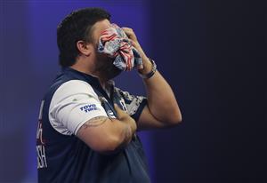 LONDON, ENGLAND - DECEMBER 22: Danny Baggish of The United States in reacts during his second round match Adrian Lewis of England against during day eight of the PDC William Hill World Darts Championship at Alexandra Palace on December 22, 2020 in London, England. (Photo by Luke Walker/Getty Images)