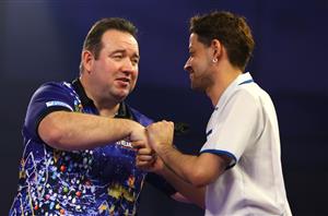 LONDON, ENGLAND - DECEMBER 22: Brendan Dolan of Northern Ireland (L) and Edward Foulkes of Japan congratulate each other after there second round match against during day eight of the PDC William Hill World Darts Championship at Alexandra Palace on December 22, 2020 in London, England. (Photo by Luke Walker/Getty Images)