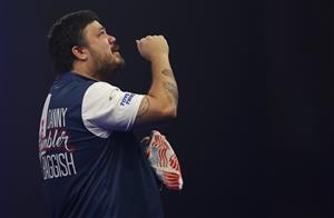 LONDON, ENGLAND - DECEMBER 22: Danny Baggish of The United States in reacts during his second round match Adrian Lewis of England against during day eight of the PDC William Hill World Darts Championship at Alexandra Palace on December 22, 2020 in London, England. (Photo by Luke Walker/Getty Images)