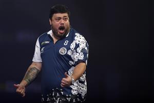 LONDON, ENGLAND - DECEMBER 22: Danny Baggish of The United States in reacts during his second round match Adrian Lewis of England against during day eight of the PDC William Hill World Darts Championship at Alexandra Palace on December 22, 2020 in London, England. (Photo by Luke Walker/Getty Images)