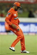 CANBERRA, AUSTRALIA - DECEMBER 22: Fawad Ahmed of the Scorchers avoids touching the ball after it was hit into the crowd during the Big Bash League match between the Sydney Thunder and the Perth Scorchers at Manuka Oval, on December 22, 2020, in Canberra, Australia. (Photo by Darrian Traynor/Getty Images)
