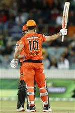 CANBERRA, AUSTRALIA - DECEMBER 22: Mitch Marsh of the Perth Scorchers raises his bat after scoring 50 runs during the Big Bash League match between the Sydney Thunder and the Perth Scorchers at Manuka Oval, on December 22, 2020, in Canberra, Australia. (Photo by Darrian Traynor/Getty Images)