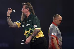 LONDON, ENGLAND - DECEMBER 22: Simon Whitlock of Australia in action during his second round match against Darius Labanauskas of Lithuania during day eight of the PDC William Hill World Darts Championship at Alexandra Palace on December 22, 2020 in London, England. (Photo by Luke Walker/Getty Images)