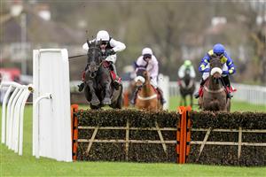 SUNBURY, ENGLAND - DECEMBER 26: Harry Skelton riding Third Time Lucki clear the last to win The Get Your Ladbrokes 1 Free Bet Novices' Hurdle at Kempton Park Racecourse on December 26, 2020 in Sunbury, England. Owners are allowed to attend if they have a runner at the meeting otherwise racing remains behind closed doors to the public due to the Coronavirus pandemic. (Photo by Alan Crowhurst/Getty Images)