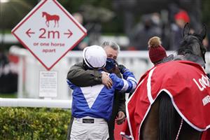 SUNBURY, ENGLAND - DECEMBER 26: Bryony Frost gets a hug from trainer Paul Nicholls after riding Frodon to win The Ladbrokes King George VI Chase at Kempton Park Racecourse on December 26, 2020 in Sunbury, England. Owners are allowed to attend if they have a runner at the meeting otherwise racing remains behind closed doors to the public due to the Coronavirus pandemic. (Photo by Alan Crowhurst/Getty Images)