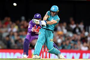 BRISBANE, AUSTRALIA - DECEMBER 27: Sam Heazlett of the Heat hits the ball over the boundary for a six during the Big Bash League match between the Brisbane Heat and the Hobart Hurricanes at The Gabba, on December 27, 2020, in Brisbane, Australia. (Photo by Bradley Kanaris/Getty Images)
