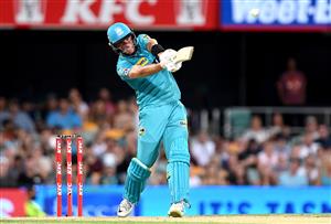 BRISBANE, AUSTRALIA - DECEMBER 27: James Bazley of the Heat hits the ball over the boundary for a six during the Big Bash League match between the Brisbane Heat and the Hobart Hurricanes at The Gabba, on December 27, 2020, in Brisbane, Australia. (Photo by Bradley Kanaris/Getty Images)