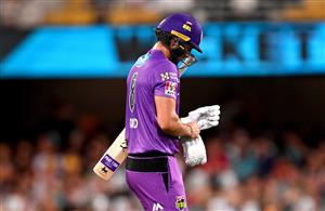 BRISBANE, AUSTRALIA - DECEMBER 27: Tim David of the Hurricanes looks dejected after losing his wicket during the Big Bash League match between the Brisbane Heat and the Hobart Hurricanes at The Gabba, on December 27, 2020, in Brisbane, Australia. (Photo by Bradley Kanaris/Getty Images)