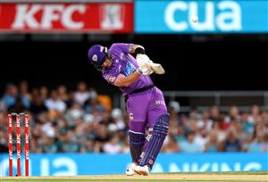 BRISBANE, AUSTRALIA - DECEMBER 27: Ben McDermott of the Hurricanes hits a six during the Big Bash League match between the Brisbane Heat and the Hobart Hurricanes at The Gabba, on December 27, 2020, in Brisbane, Australia. (Photo by Bradley Kanaris/Getty Images)