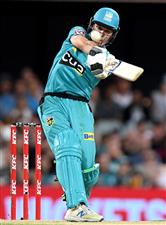 BRISBANE, AUSTRALIA - DECEMBER 27: Sam Heazlett of the Heat hits the ball over the boundary for a six during the Big Bash League match between the Brisbane Heat and the Hobart Hurricanes at The Gabba, on December 27, 2020, in Brisbane, Australia. (Photo by Bradley Kanaris/Getty Images)