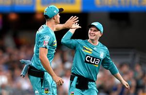 BRISBANE, AUSTRALIA - DECEMBER 27: James Bazley of the Heat celebrates after taking the catch to dismiss Darcy Short of the Hurricanes during the Big Bash League match between the Brisbane Heat and the Hobart Hurricanes at The Gabba, on December 27, 2020, in Brisbane, Australia. (Photo by Bradley Kanaris/Getty Images)