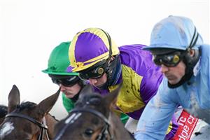 SUNBURY, ENGLAND - DECEMBER 27: A general view of close action of the jockeys during The Get Your Ladbrokes 1 Free Bet Introductory Juvenile Hurdle at Kempton Park Racecourse on December 27, 2020 in Sunbury, England. Owners are allowed to attend if they have a runner at the meeting otherwise racing remains behind closed doors to the public due to the Coronavirus pandemic. (Photo by Alan Crowhurst/Getty Images)