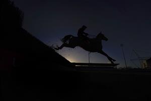 SUNBURY, ENGLAND - DECEMBER 27: A general view as runners clear a fence during The Ladbrokes Committed To Safer Gambling Handicap Chase at Kempton Park Racecourse on December 27, 2020 in Sunbury, England. Owners are allowed to attend if they have a runner at the meeting otherwise racing remains behind closed doors to the public due to the Coronavirus pandemic. (Photo by Alan Crowhurst/Getty Images)