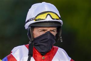 SUNBURY, ENGLAND - DECEMBER 27: Jockey David Crosse makes his way to the parade ring on his last day as a professional jockey at Kempton Park Racecourse on December 27, 2020 in Sunbury, England. Owners are allowed to attend if they have a runner at the meeting otherwise racing remains behind closed doors to the public due to the Coronavirus pandemic. (Photo by Alan Crowhurst/Getty Images)