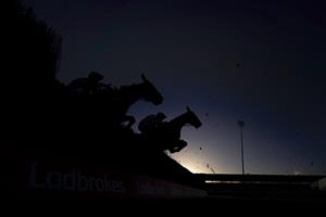 SUNBURY, ENGLAND - DECEMBER 27: A general view as runners clear a fence during The Ladbrokes Committed To Safer Gambling Handicap Chase at Kempton Park Racecourse on December 27, 2020 in Sunbury, England. Owners are allowed to attend if they have a runner at the meeting otherwise racing remains behind closed doors to the public due to the Coronavirus pandemic. (Photo by Alan Crowhurst/Getty Images)