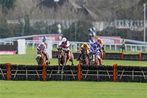 SUNBURY, ENGLAND - DECEMBER 27: Harry Skelton riding Molly Ollys Wishes (white cap) clear the last to win The Play Ladbrokes 5-A-Side On Football Mares' Handicap Hurdle at Kempton Park Racecourse on December 27, 2020 in Sunbury, England. Owners are allowed to attend if they have a runner at the meeting otherwise racing remains behind closed doors to the public due to the Coronavirus pandemic. (Photo by Alan Crowhurst/Getty Images)