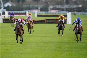 SUNBURY, ENGLAND - DECEMBER 27: Harry Skelton riding Molly Ollys Wishes (white cap) clear the last to win The Play Ladbrokes 5-A-Side On Football Mares' Handicap Hurdle at Kempton Park Racecourse on December 27, 2020 in Sunbury, England. Owners are allowed to attend if they have a runner at the meeting otherwise racing remains behind closed doors to the public due to the Coronavirus pandemic. (Photo by Alan Crowhurst/Getty Images)