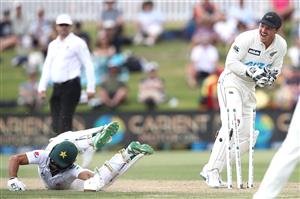 TAURANGA, NEW ZEALAND - DECEMBER 28: Fawad Alam of Pakistan dives to make his ground as BJ Watling of New Zealand attempts a runout during day three of the First Test match in the series between New Zealand and Pakistan at Bay Oval on December 28, 2020 in Tauranga, New Zealand. (Photo by Phil Walter/Getty Images)