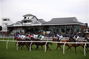 CATTERICK, ENGLAND - DECEMBER 28: Racegoers watch the action from the Sky Bet Extra Places Every Day Maiden Hurdle at Catterick Racecourse on December 28, 2020 in Catterick, England. (Photo by Tim Goode - Pool / Getty Images)