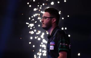 LONDON, ENGLAND - DECEMBER 28: Adam Hunt of England walks into the arena during his third round match against Dirk van Duijvenbode of The Netherlands during day eleven of the PDC William Hill World Darts Championship at Alexandra Palace on December 28, 2020 in London, England. (Photo by Luke Walker/Getty Images)