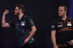 LONDON, ENGLAND - DECEMBER 28: Adam Hunt of England in action during his third round match against Dirk van Duijvenbode of The Netherlands during day eleven of the PDC William Hill World Darts Championship at Alexandra Palace on December 28, 2020 in London, England. (Photo by Luke Walker/Getty Images)