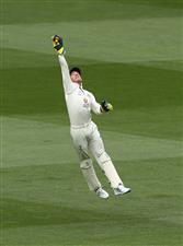 MELBOURNE, AUSTRALIA - DECEMBER 28: Tim Paine of Australia leaps for the ball during day three of the Second Test match between Australia and India at Melbourne Cricket Ground on December 28, 2020 in Melbourne, Australia. (Photo by Robert Cianflone/Getty Images)