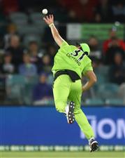 CANBERRA, AUSTRALIA - DECEMBER 29: Adam Milne of the Thunder attempts to make a catch during the Big Bash League match between Sydney Thunder and the Melbourne Stars at Manuka Oval, on December 29, 2020, in Canberra, Australia. (Photo by Mike Owen/Getty Images)
