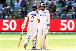 MELBOURNE, AUSTRALIA - DECEMBER 29: Shubman Gill of India (R) and Ajinkya Rahane of India in action during day four of the Second Test match between Australia and India at Melbourne Cricket Ground on December 29, 2020 in Melbourne, Australia. (Photo by Kelly Defina/Getty Images)