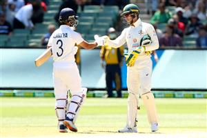 MELBOURNE, AUSTRALIA - DECEMBER 29: Ajinkya Rahane of India (L) and Tim Paine (c) of Australia after India wins during day four of the Second Test match between Australia and India at Melbourne Cricket Ground on December 29, 2020 in Melbourne, Australia. (Photo by Kelly Defina/Getty Images)