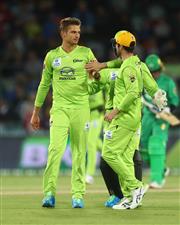 CANBERRA, AUSTRALIA - DECEMBER 29: Chris Green of the Thunder celebrates with Callum Ferguson of the Thunder after dismissing Ben Dunk of the Stars during the Big Bash League match between Sydney Thunder and the Melbourne Stars at Manuka Oval, on December 29, 2020, in Canberra, Australia. (Photo by Mike Owen/Getty Images)