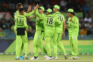 CANBERRA, AUSTRALIA - DECEMBER 29: Thunder players celebrate after dismissing Marcus Stoinis of the Stars during the Big Bash League match between Sydney Thunder and the Melbourne Stars at Manuka Oval, on December 29, 2020, in Canberra, Australia. (Photo by Mike Owen/Getty Images)