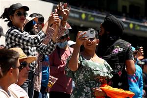 MELBOURNE, AUSTRALIA - DECEMBER 29: Fans celebrate India winning during day four of the Second Test match between Australia and India at Melbourne Cricket Ground on December 29, 2020 in Melbourne, Australia. (Photo by Kelly Defina/Getty Images)
